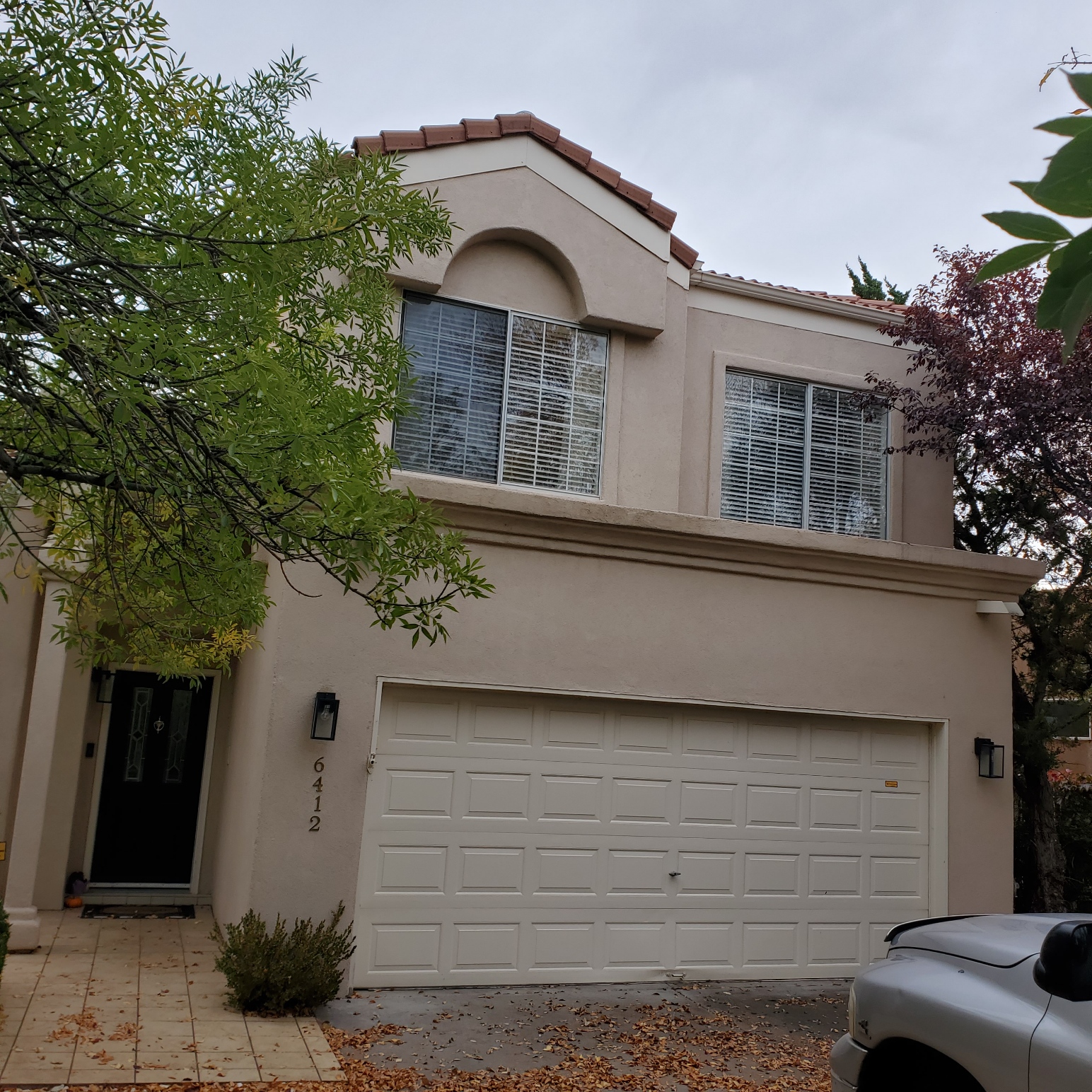 Modern two-story stucco home with attached garage in Albuquerque, NM